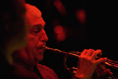 Portrait of Valery Ponomarev playing trumpet